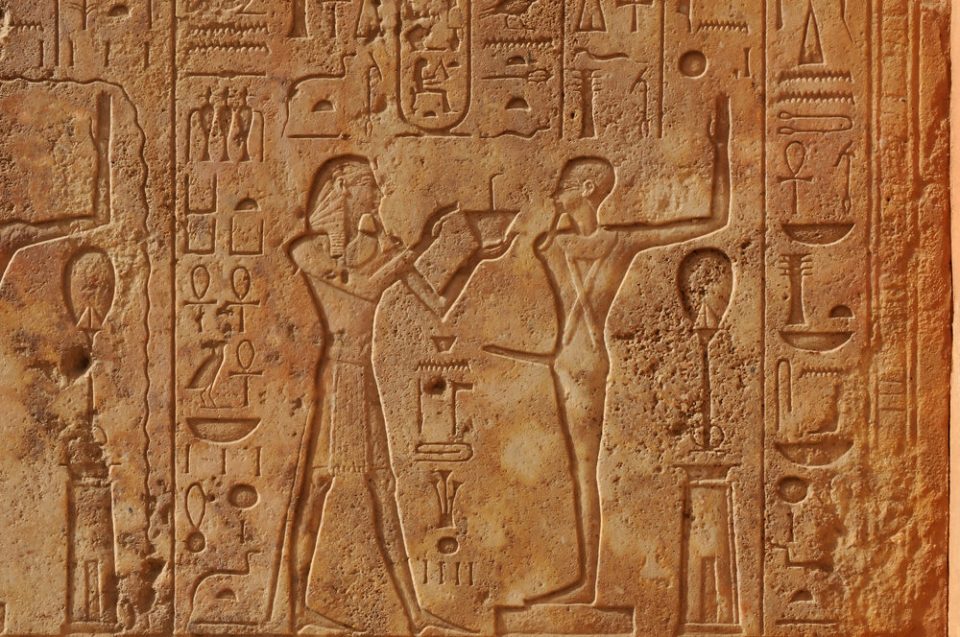 Pharoah presenting a gift to the ithyphallic god Min at the great ancient Egyptian temple of Amun at Karnak, Luxor in Egypt