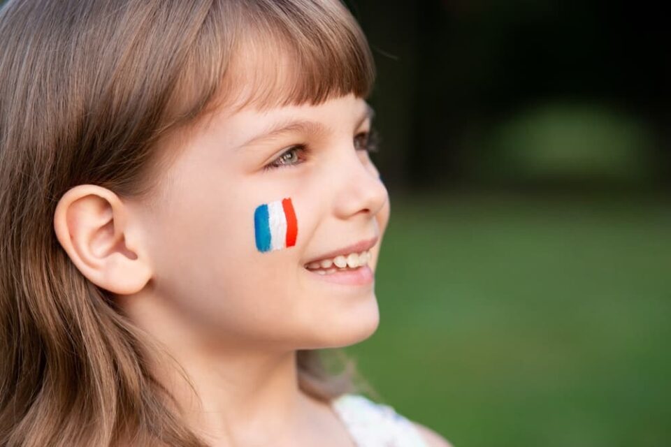 French flag face paint on a child
