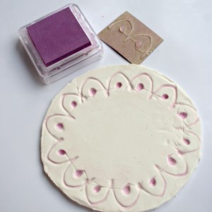 Step 4 - make a clay diya with kids, color the stamp pattern