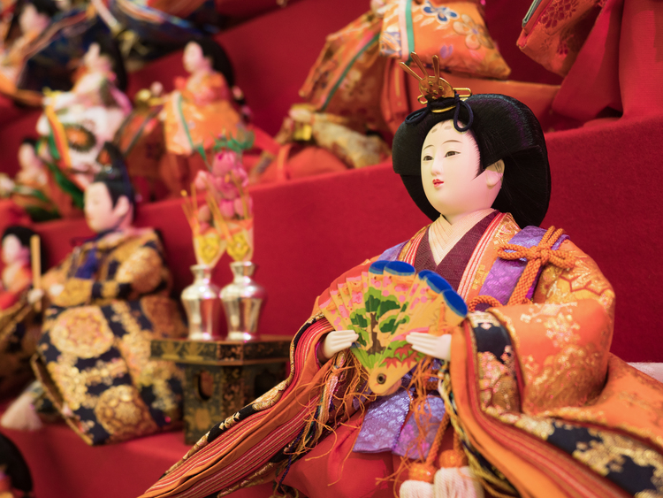 A close-up of a doll in a Hinamatsuri display.