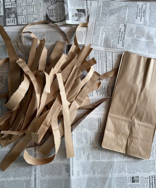 create a papyrus scroll step 2: tear paper bags into half inch strips
