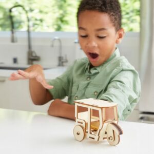 boy playing with toy car