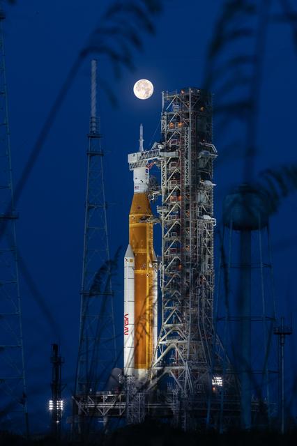 SLS rocket being tested with the full moon above it