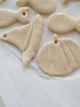 Baked holiday salt dough ornaments before decorating