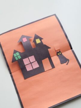 Spooky house and cat glued onto pop-up Halloween card