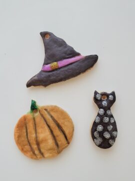 Finished holiday salt dough ornaments decorated for Halloween