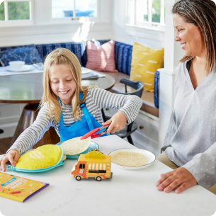 girl cooking with mother