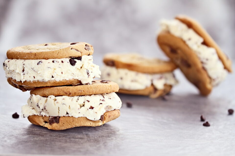 Four ice cream sandwiches made with chocolate chip cookies