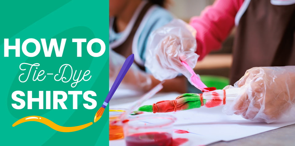 A child wearing plastic gloves and coloring a piece of fabric tied with rubber bands