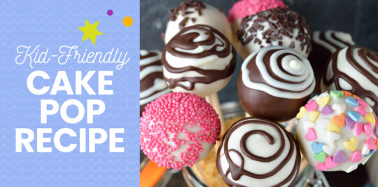 Assorted cake pops decorated with white and dark chocolate and sprinkles.