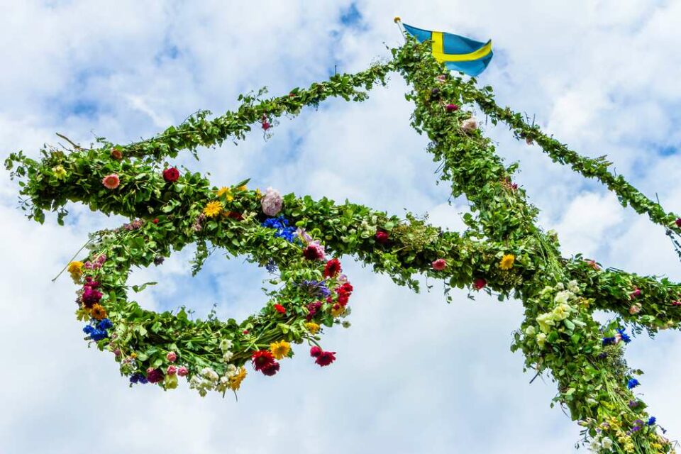 Maypole with the Swedish flag on top