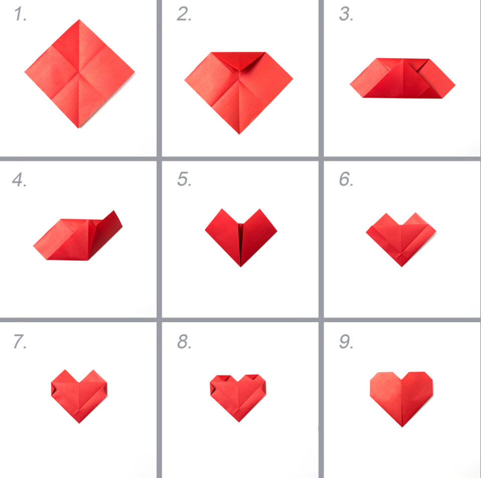 Step-by-step photos showing how to fold red origami paper into a heart.