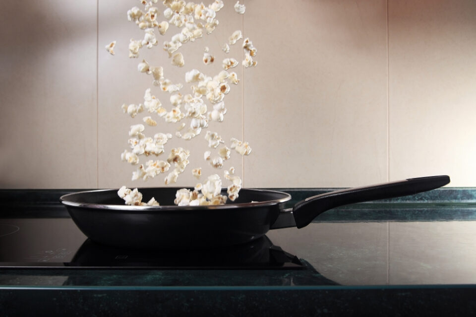 Popcorn jumping out of a frying pan.