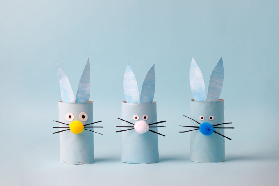 Three light-blue Easter Bunny paper rolls.