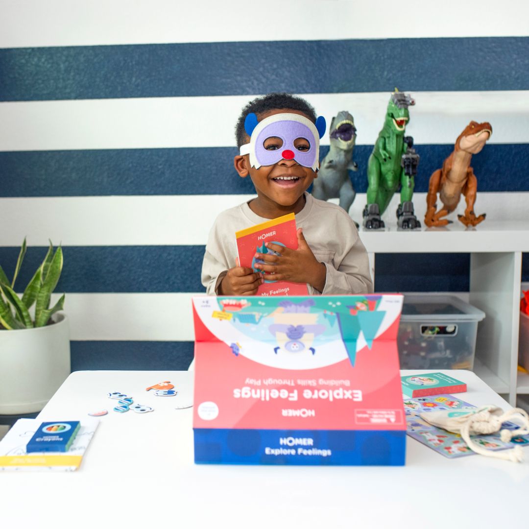 Kid playing with HOMER explore feelings kit