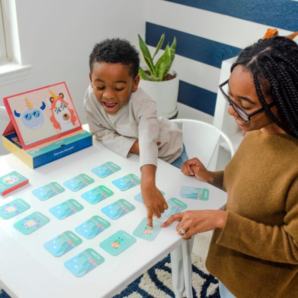 Mom and kid playing with HOMER explore feelings kit