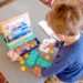 Kid playing with HOMER explore numbers kit