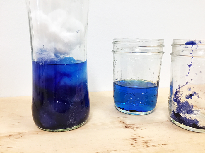 place cotton balls in jar, then pour colored water over