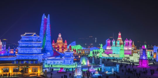 Full lighted cityscape of ice sculpture at the Harbin International Ice and Snow Sculpture Festival