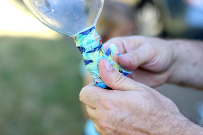 attaching duct tape to bottle and hose