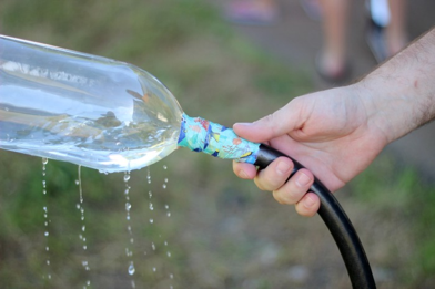 dripping soda bottle sprinkler