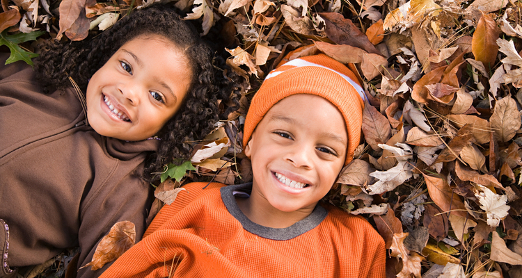Kids with fall leaves