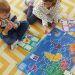 Children playing with Where To? board game