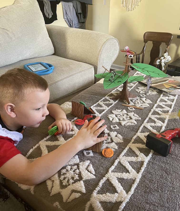 Boy enjoying Little Passports' Animals Wild subscription box