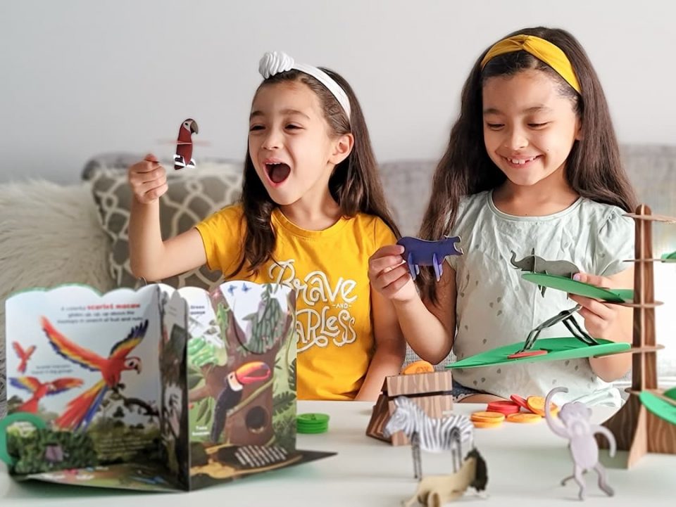 Children playing with the Animals Wild subscription box from Little Passports