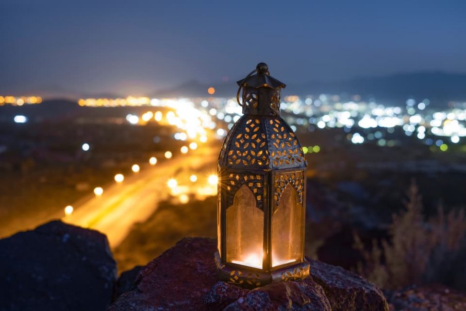A Ramadan lantern on a hill at night